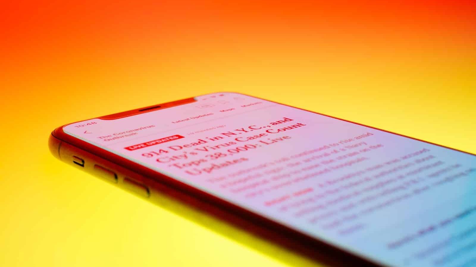 black android smartphone on orange surface