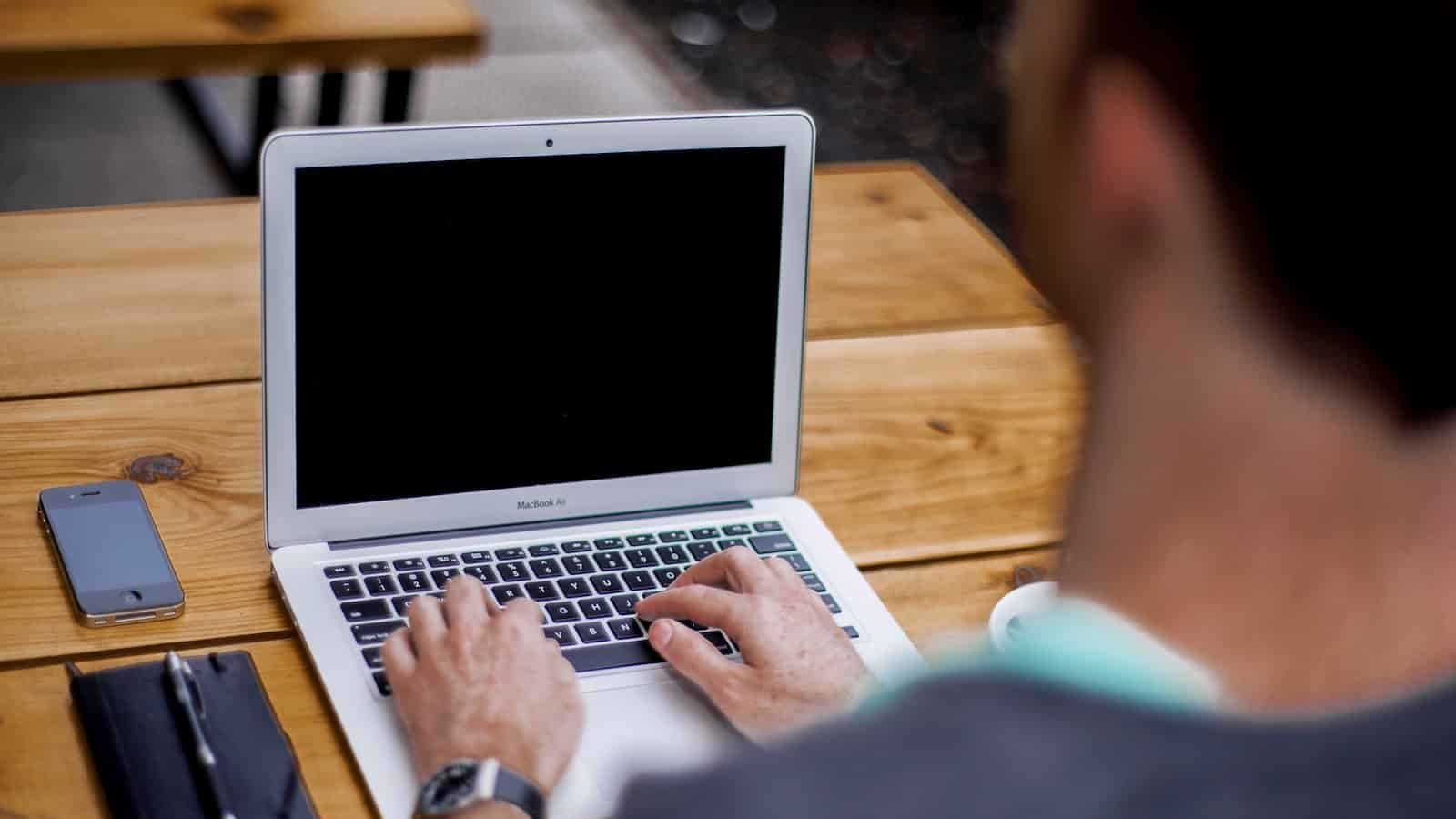 man using MacBook Air