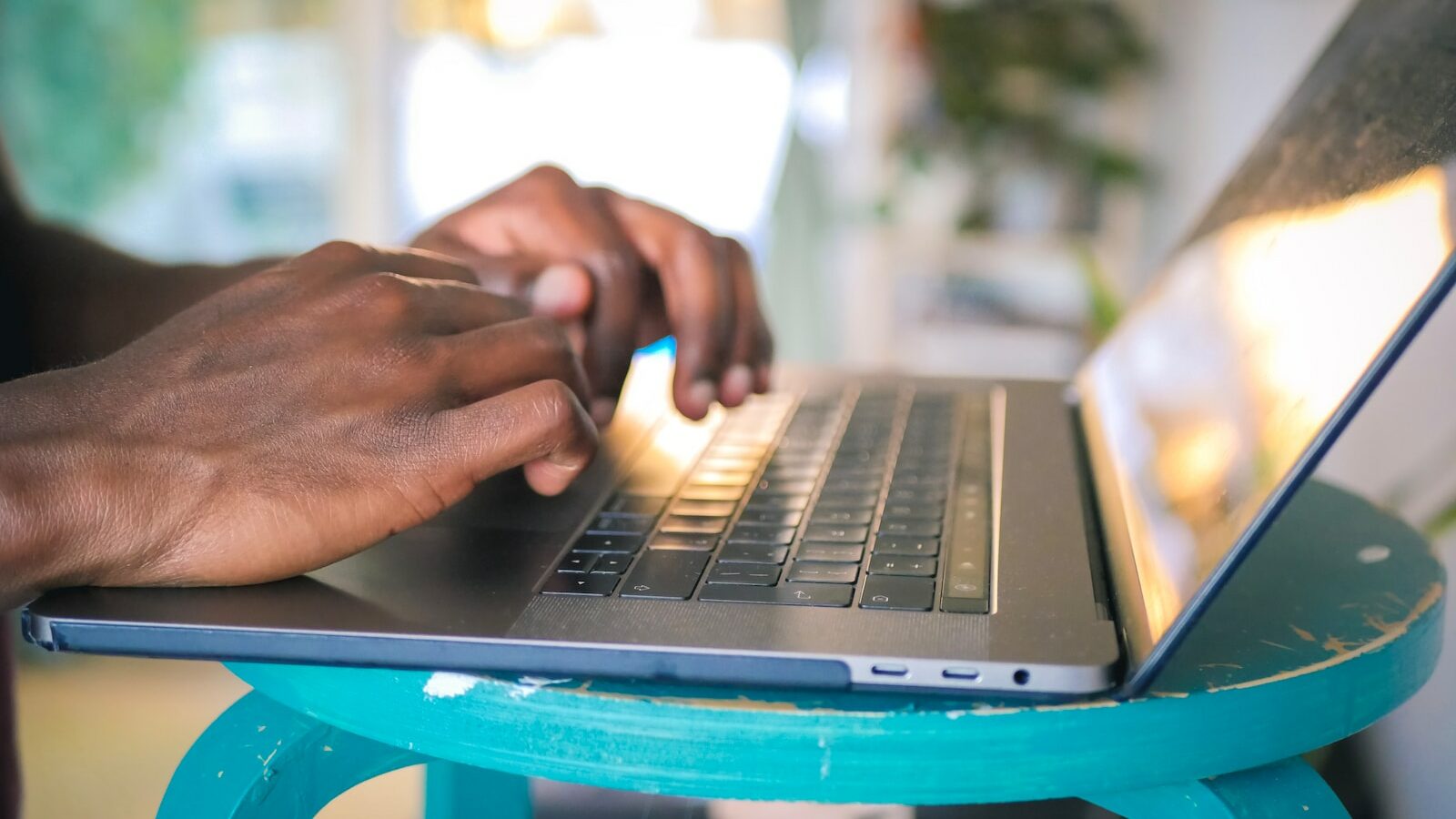 person using silver laptop computer