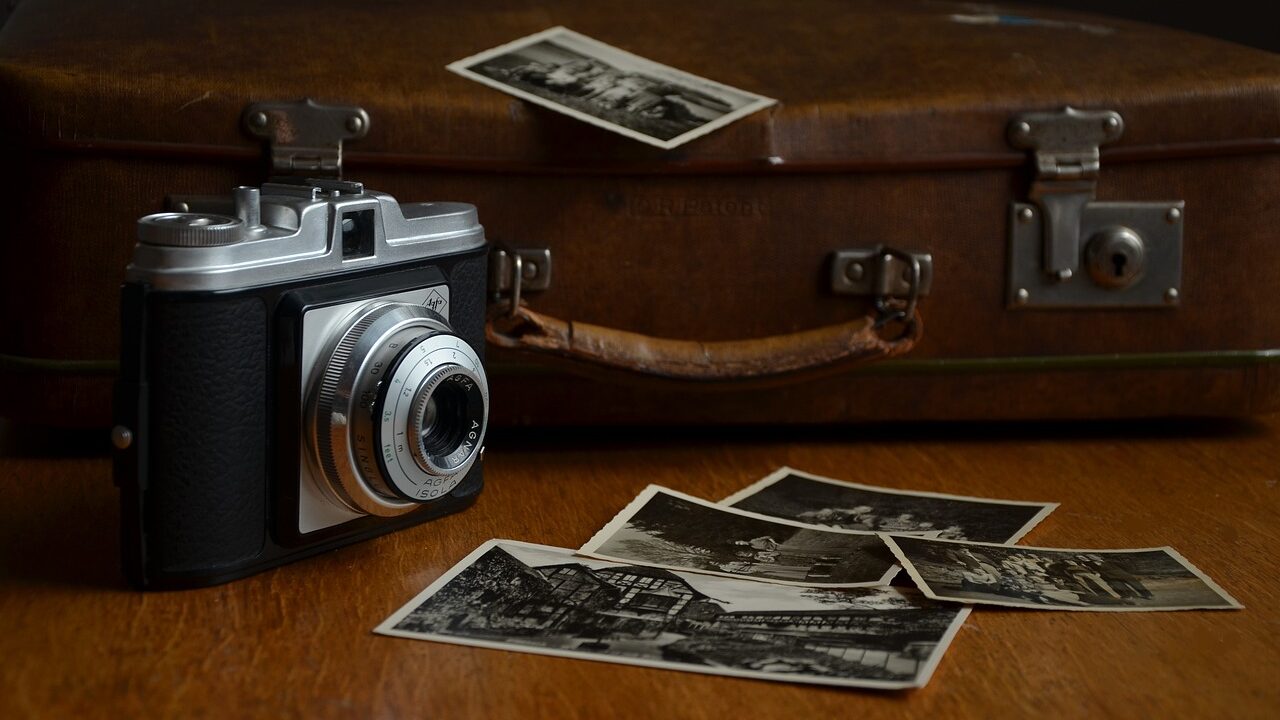 camera, luggage, polaroid photos